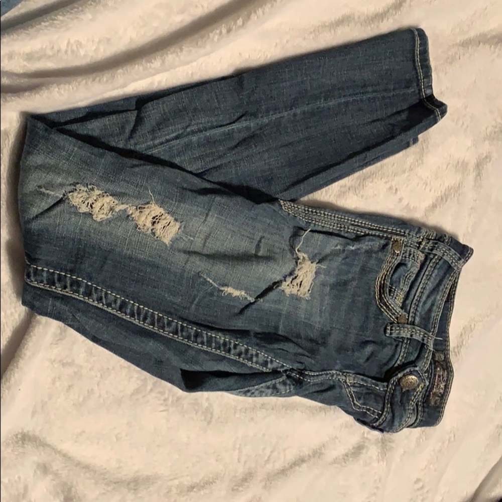 Silver jeans, rips, skinny.